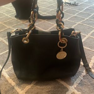 Michael Kors small black and gold purse. Great condition- barely used